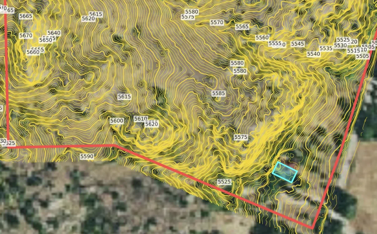 Contour lines and parcel boundary over satellite imagery for one site