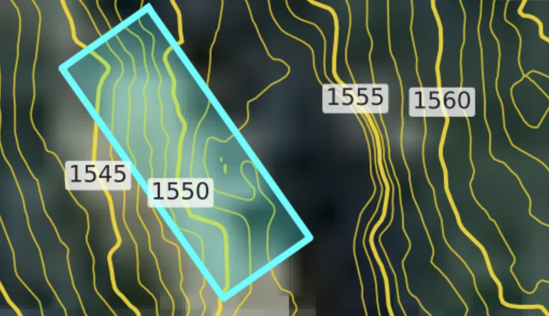 Yellow contour lines and a parcel outlined in cyan lined up on the same site