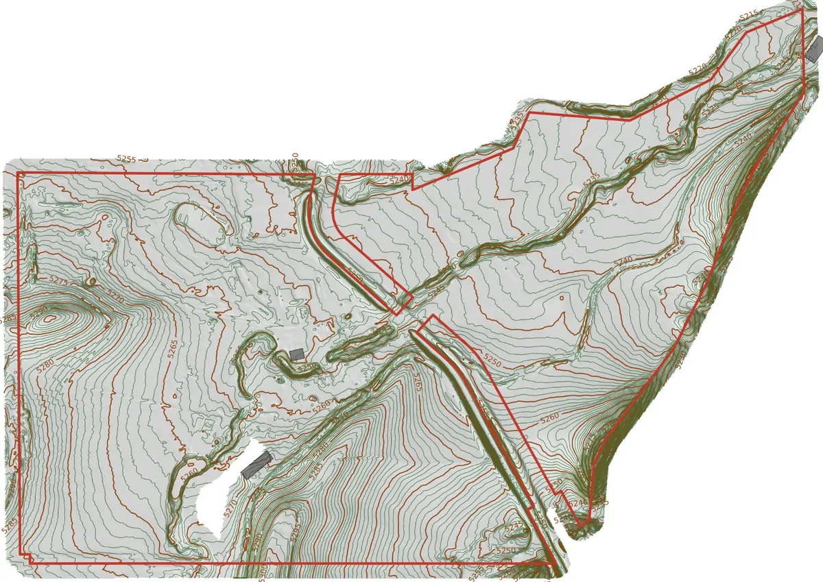 Parcel boundary in red over contour lines and shaded terrain